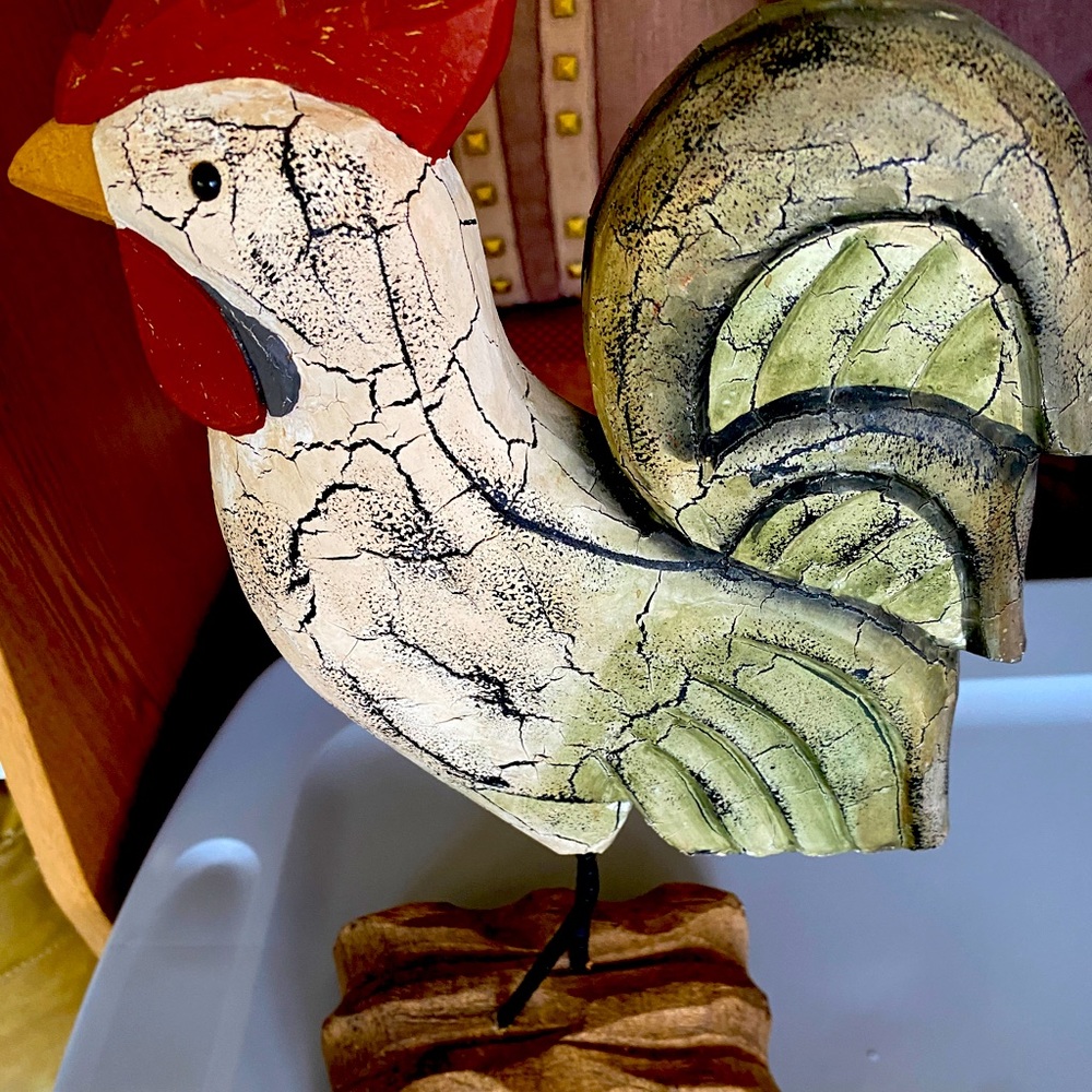 Wooden chicken on a wooden platform